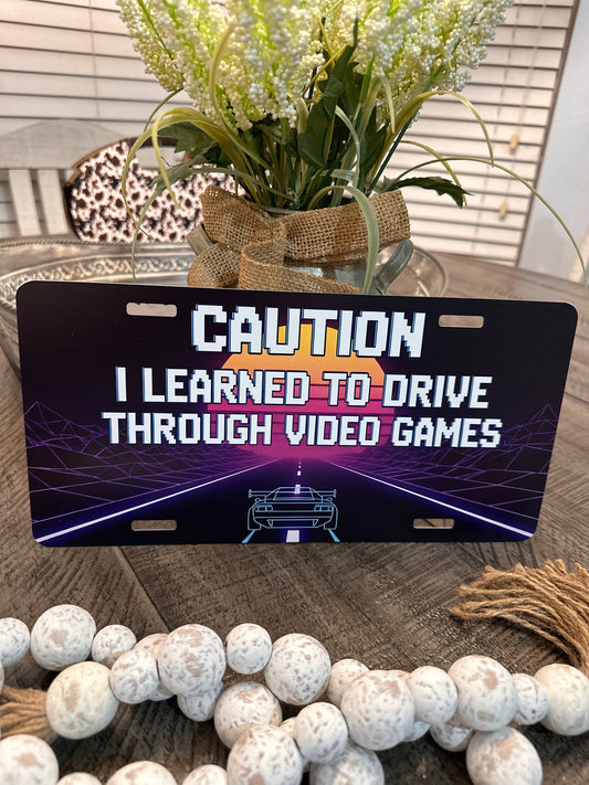 LEARNED TO DRIVE THROUGH VIDEO GAMES-LICENSE PLATE